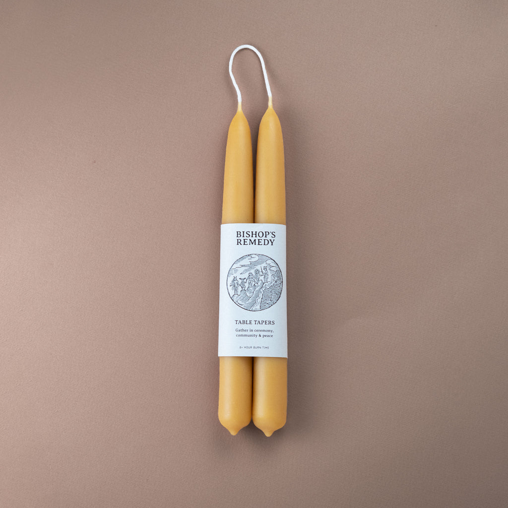 Pair of pure beeswax hand-dipped 22cm taper candles with Bishop's Remedy brand wrap