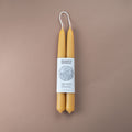 Pair of pure beeswax hand-dipped 22cm taper candles with Bishop's Remedy brand wrap