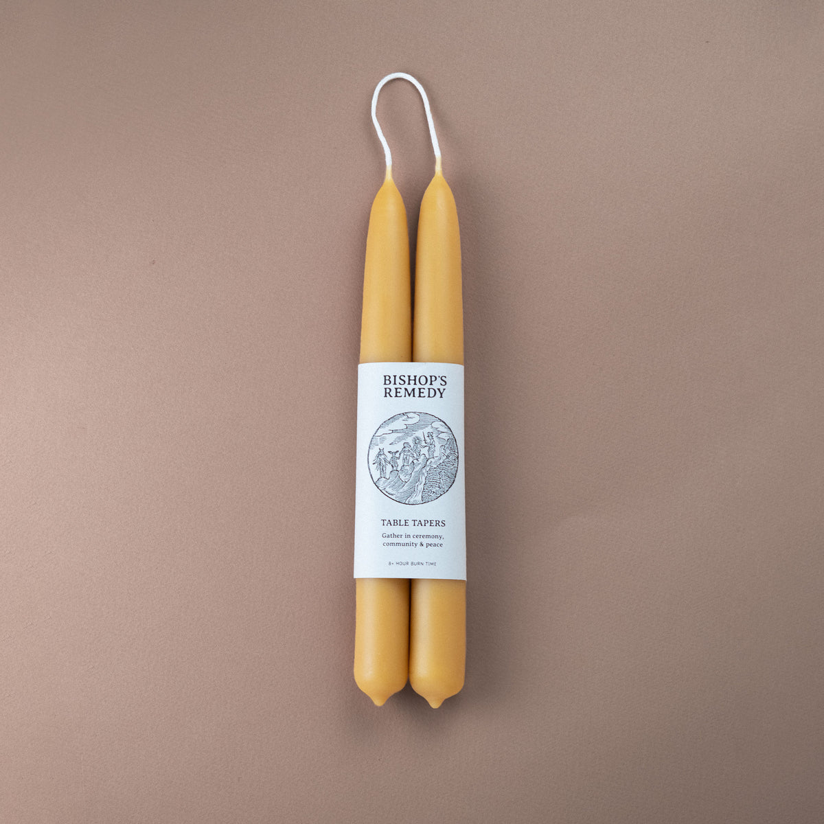 Pair of pure beeswax hand-dipped 22cm taper candles with Bishop's Remedy brand wrap